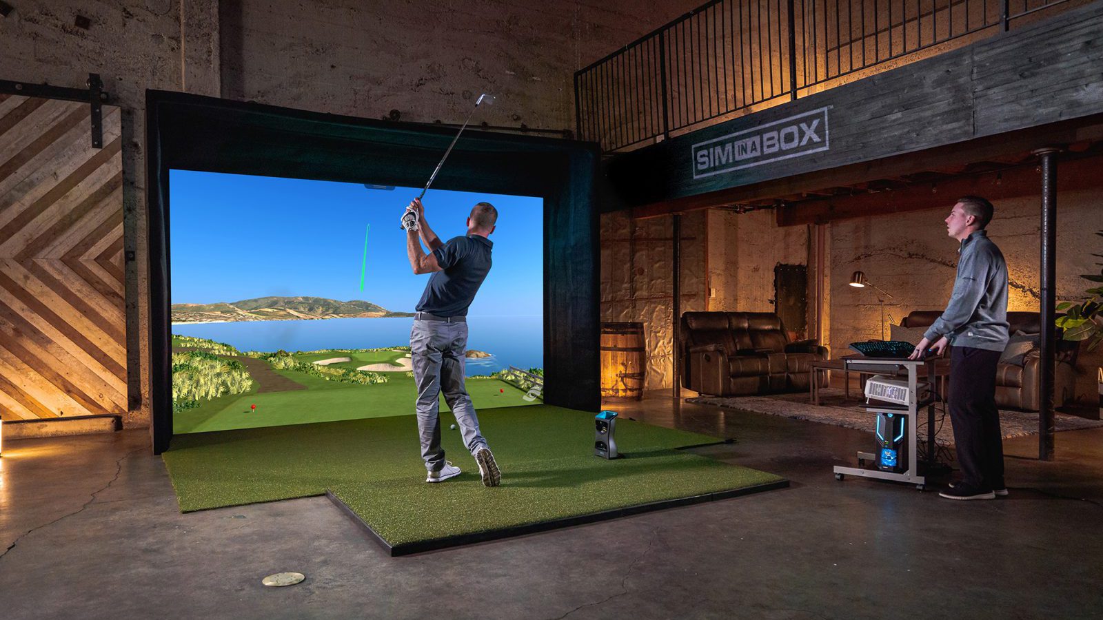 Golfer swings club indoors using the foresight performance analysis technology while expert looks on